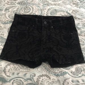 Black denim shorts with velvet